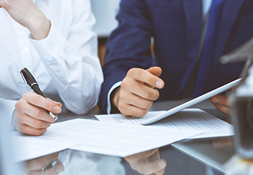 Credit Union Auditing near syracuse ny panel image of business workers meeting with clients from T Gschwender & Associates